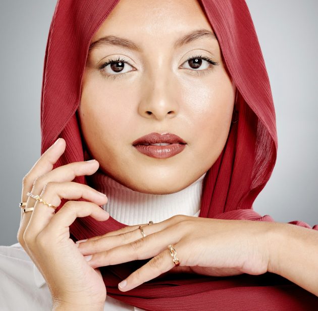 Closeup portrait of a beautiful muslim woman posing in a studio with a hijab. Headshot of a stunnin